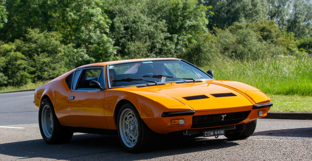 1974 De Tomaso Pantera classic car driving on a country road