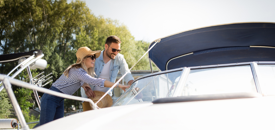 A young couple looking to buy a boat and wanting to learn about the best insurance for boats. 