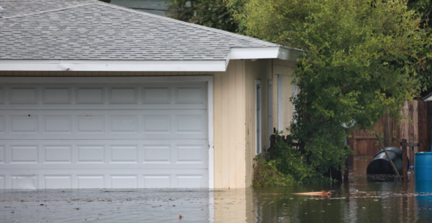 The outside of a garage that has been affected from high flood water.