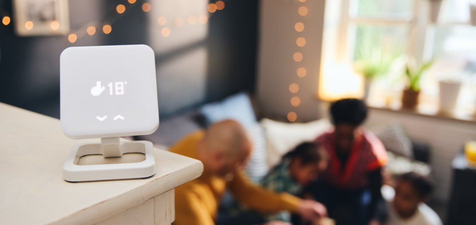 Smart home technology controls energy use through a thermostat, lighting, and mobile app.