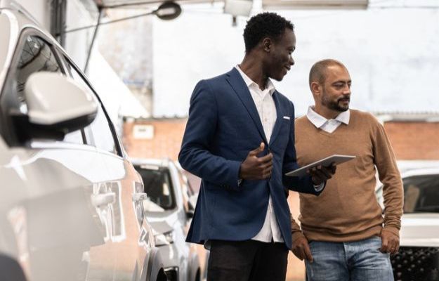 Two men survey their commercial fleet. 