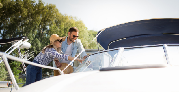 A young couple looking to buy a boat and wanting to learn about the best insurance for boats. 